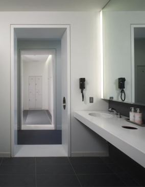 The minimalist aesthetic is carried through to the fitness center locker rooms.