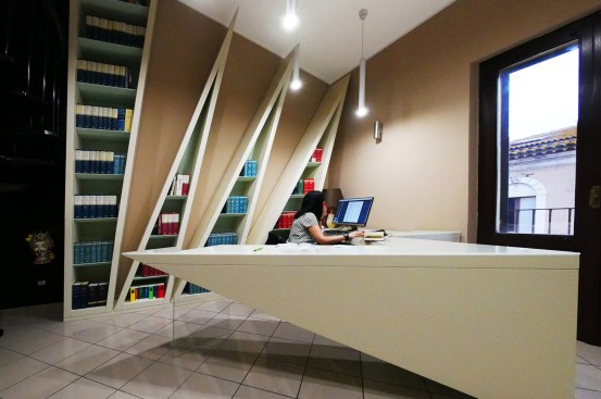 View of the bookshelves and the futuristic work dashboard