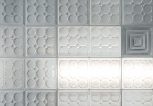 Exercisers facing upwards have a more attractive, intriguing view than a flat ceiling could provide. LED strips above translucent ceiling panels provide moderate, easy-on-the-eyes lighting, and brighten the neighboring opaque white panels.