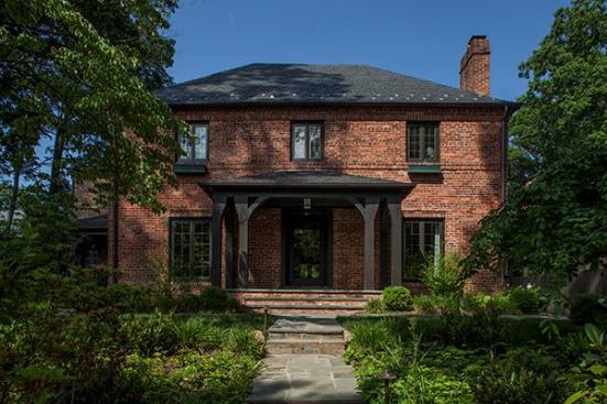The facade was restored using recycled materials from the original timber porch on the side and the home's slate roof. All of the windows were replaced with Norwood windows (norwoodwindows.ca), improving energy efficiency.