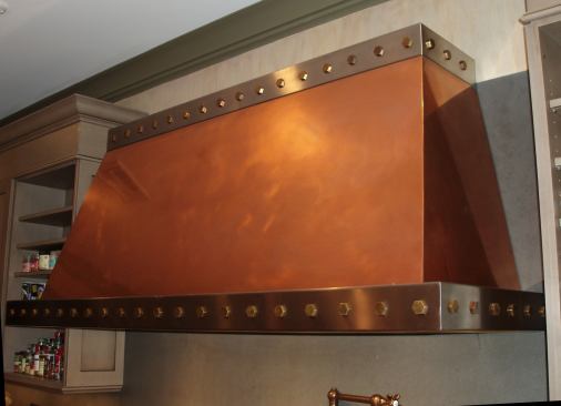 Brushed copper with polished stainless steel band and bronze rivets. Project: Brownstone Renovation, New York; Designer/Fabricator: Brooks Custom, Mt. Kisco, N.Y.