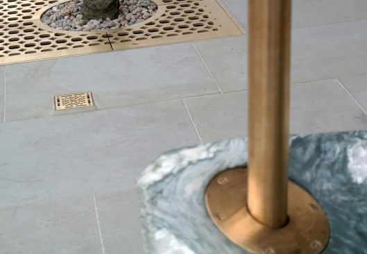 Detail of custom made brass tree grille.