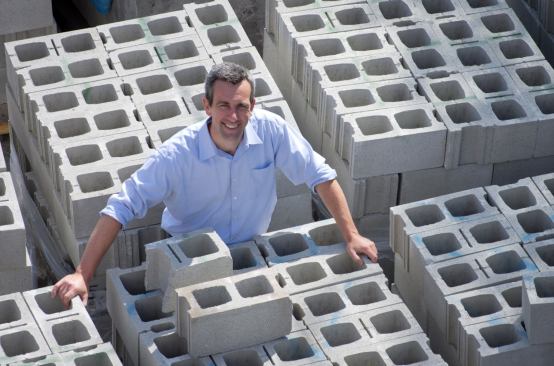 Atlas CMU Block with CarbonCure The CarbonCure Block System injects carbon dioxide supplied from local industrial sources directly into concrete masonry units (CMUs) during production using a specially designed mold. The company is using the CarbonCure system primarily to reduce the carbon footprint of its products, but injecting carbon dioxide into CMUs during manufacture also improves their strength, reduces the amount of Portland cement required, and speeds curing. 
atlasblock.com.