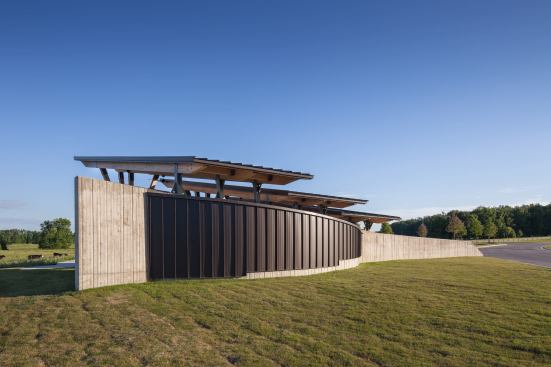 The board-formed concrete bearing wall shields also serves as a barrier from the nearby driveway.