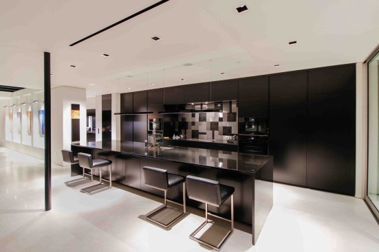 Georgina Avenue Santa Monica modern home open plan kitchen with all black palette