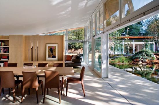 Freestanding interior wood partitions define the main living spaces.