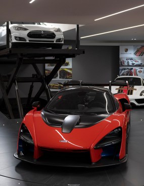 Serenity Indian Wells modern mansion luxury car garage with Ayrton Senna sculpture