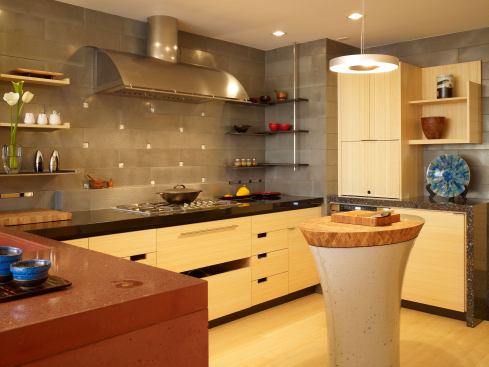 Kitchen storage is a combination of bamboo cabinets for stashing cookware and appliances, plus open shelving for favorite objects collected by the homeowner during her travels. Cheng appreciates the clean lines of modernism, but he also likes the friendly appeal of open storage.