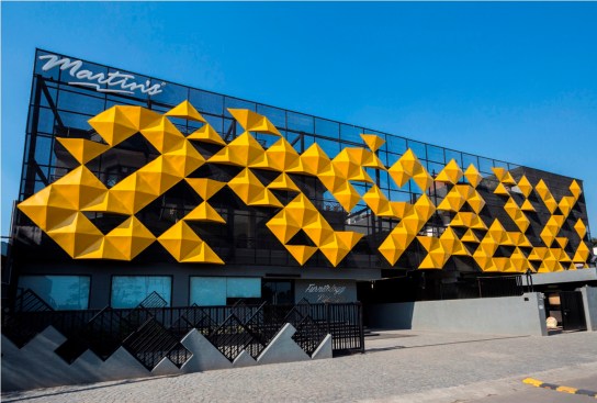 The striking yellow panels stand out in the dull background