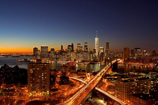 Night view of 1 World Trade Center from Brooklyn, showing the redesigned spire.