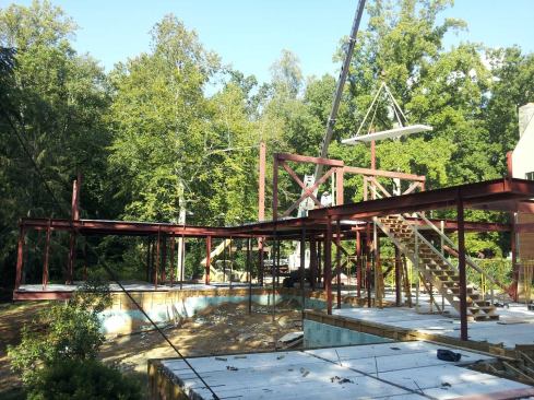 A construction image showing the concrete floor and wall panels being installed in the Oscillating House. Jameson is also designing systems to measure the amount of water being retained by the green roofs or being diverted into the water recycling tanks. He hopes to track the amount of water and energy the house conserves over time.