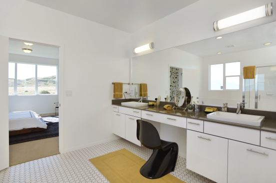 Quartz countertops offer a stylish look in the master bedroom.