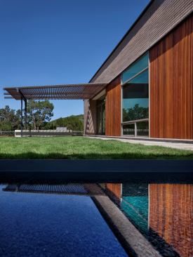 This home is in a conventional neighborhood, but a reflecting pool in the courtyard sets a tranquil and sophisticated vibe. Project: Scout Island Residence, Austin, Texas; Builder: Stearns Construction, Austin; Architect: alterstudio, Austin; Landscape Architect: David Wilson Garden Design, Austin