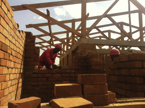 Construction with compressed stabilized earth blocks (CSEB) at Maternity Waiting Village.