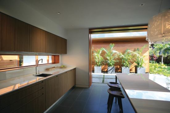 Sliding glass panels open the pavilions to the gardens.