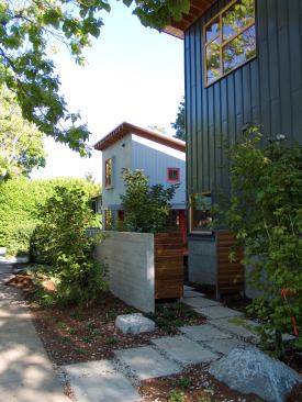 The house and adjacent laneway house sit on a 40-by-86-foot corner lot just off of a busy commercial corridor in downtown Vancouver.