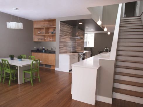 Yao_Residence  Award of Merit 
Perimeter Architects Yao_Residence sits 30 feet from a major rail-transit hub on Chicago’s north side, a proximity that required attention to sound, views, and opportunities to incorporate natural light. The 3,000-square-foot wood-framed single-family structure’s west wall, which faces the tracks, was fitted with a standing seam metal panel cladding and filled with open-cell spray foam insulation to buffer noise. The wall was limited to one 6-foot-squared deep set window, with existing skylights offering additional natural light and ventilation. Architects added a “slice” to the existing roof to offset weight from a weak wood frame and hide mechanical equipment.