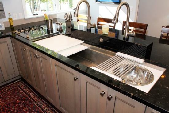 The customizable and highly functional Galley Sink lets homeowners maximize their sink size without sacrificing prep space. Available in 4-, 5 1/2-, or 7-foot lengths, the Galley Sink comes outfitted with cutting boards, colanders, work bowls, and drain boards that slide easily along stepped channels in the top edge of the sink. Users can easily go from prep to clean-up, and even to presentation by filling the sink with ice and using it as a serving space. Suitable for indoor or outdoor use. 
thegalleysink.com.