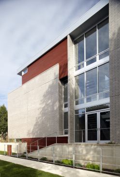 Tucked into an urban neighborhood in Chicago, this home, built for a young couple with two children, attributes its urban industrial identity with steel windows and exposed masonry. The design pushed shared spaces to the upper level, allowing them to take advantage of natural light. Project: 3701 South Parnell, Chicago; Architect/Builder/Interior Designer: Studio Dwell, Chicago