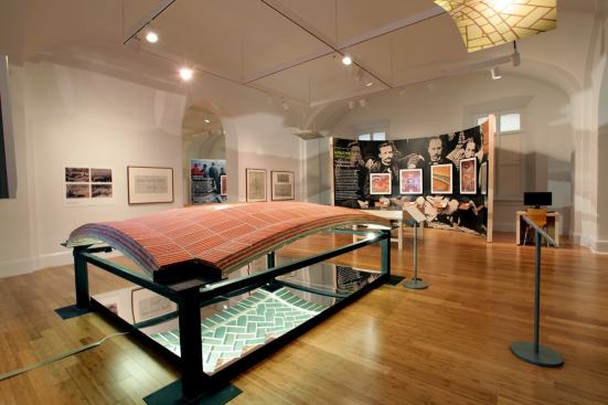 The NBM exhibition features a half-scale replica of a vaulted ceiling at the Boston Public Library.