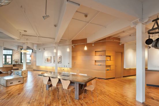 The husband’s space is highlighted by angular details that include wood, MDF, and steel.