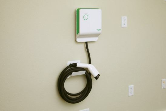 The home is equipped with a residential-style electric vehicle charger.