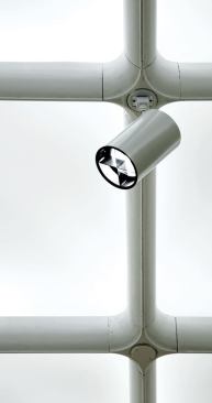 The newly renovated lighting system uses the coffer track for a series of spotlights, which accent the artworks.