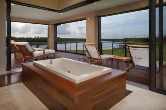 Retractable walls allow bathers to enjoy lake breezes and warm Florida air even in the tub. Project: Deland Modern, Deland, Fla.; Architect/Builder: Phil Kean Designs, Winter Park, Fla.
