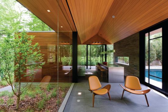 Natural materials include bluestone flooring, stone and mahogany walls, and a Douglas fir ceiling.