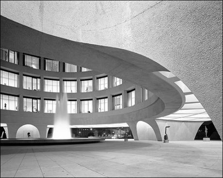The cylindrical museum's central fountain plaza at night