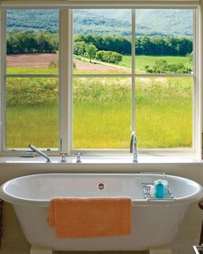 This extra-large window offers an updated feel to the bath’s design, as well as a supremely serene view. Project: Geier House, Williamstown, Mass.; Architect: Burr and McCallum Architects, Williamstown; Builder: Albert J. Cummings; General Contractor, Williamstown