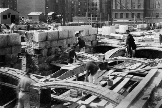 Rafael Guastavino, Sr. stands on a newly constructed arch at the Boston Public Library designed by McKim, Mead, and White (1889)