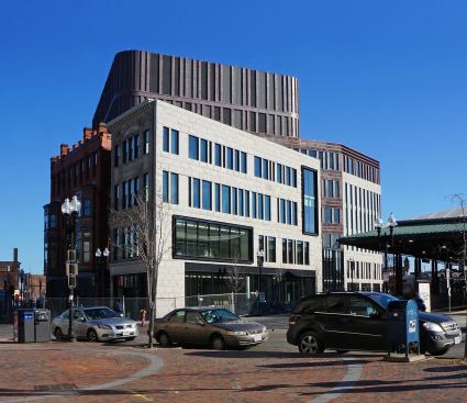 Southwest corner of the building, which features the restored façades of the Curtis Block (far left) and the Waterman & Sons building (left).