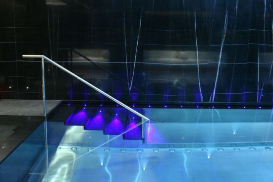  A specially designed fiber optic steplight at the  feature wall in the pool has a color wheel so that clients can change the color  depending on their mood or if there is a special event.