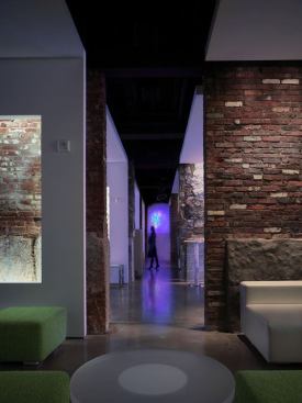 A central corridor connects the four Salons.