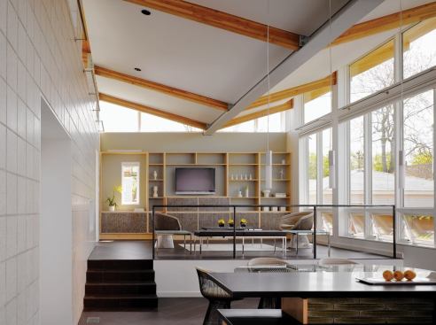 Architect: 
Farr Associates, Chicago; 
Builder: 
Goldberg General Contracting, Chicago. Blond wood beams support the butterfly roof that appears to be floating above this Chicago-area great room. The light wood provides definition and depth to the pale color scheme in the space. 
Read more about the builder of this house and see more iamges of the project here.