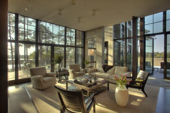 Architect Jim Thomas believes a house in this humid climate needs to breathe. Case in point: the living room opens up to decks on two sides.