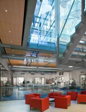  The magnetic resonance laboratory is a featured lab  with a public aesthetic. Remote metal halide illuminators serve miniature fiber  optic downlights to avoid metallic components and maintenance interruptions  within the 24/7 facility.