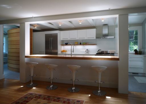 Seating is outside the working area of this galley kitchen, but definitely a part of it. Project: Kitchen Wedge, Silver Spring, Md.; Architect: Treacy & Eagleburger Architects; Builder: Jos. Klockner & Company