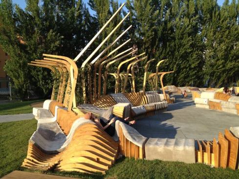 The benches are made from ribs of marine-grade plywood, with sections covered in a concrete canvas material.