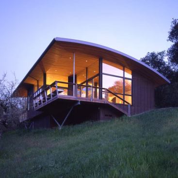 Architect: Kent Chilcott, Kent Chilcott Studio, Santa Rosa, California &nbsp; This modest, 1600 square foot residence caught the judges' attention. They labeled the project 
Best in Show. Just as the home floats above its California hillside site, the bowed roof form floats above the open and spacious interiors.