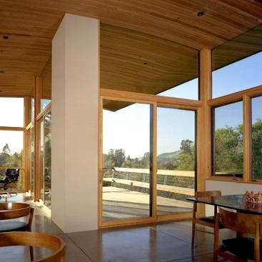 Architect: Kent Chilcott, Kent Chilcott Studio, Santa Rosa, California &nbsp; Marvin clad patio doors, casements, awnings and custom curved-head fixed windows allow for floor to ceiling fenestration, with glass that is seamlessly set in to the exposed wood ceiling.