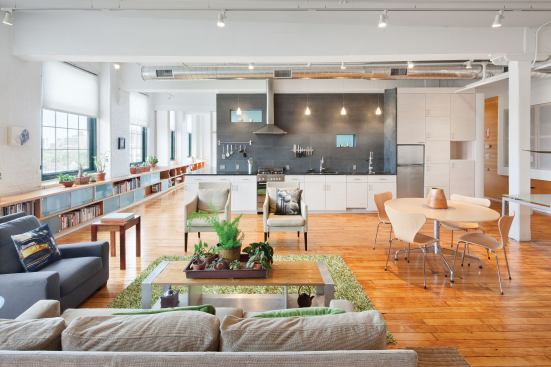 The wife’s live/work space is more light-filled and airy, marked by soft, rounded corners, translucent panels, frosted glass tiles, and soapstone.