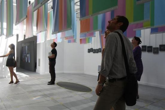Visitors to the U.S. Pavilion read about the projects highlighted in "Spontaneous Interventions."
