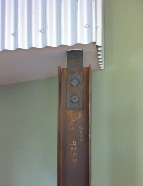 One of the living room’s support beams is an off-the-shelf wide flange column from a steelyard.