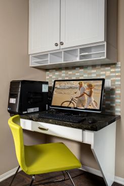 This entry-level home with 1,695 square feet still manages to squeeze in some home office space with a built-in workstation in the kitchen that serves both as a mini-office and a station to quickly check email and recipes while baking cookies. Project: ABC Green Home, Irvine, Calif.; Architect: KTGY Architecture, Irvine