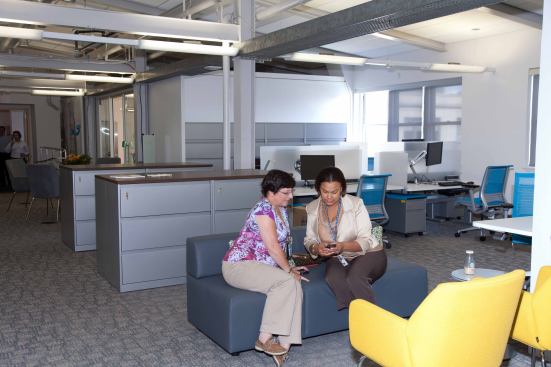 The workplace includes informal seating areas.