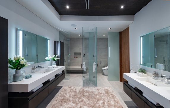 Luxury modern indoor outdoor home with sliding glass walls that open to the view and pool.