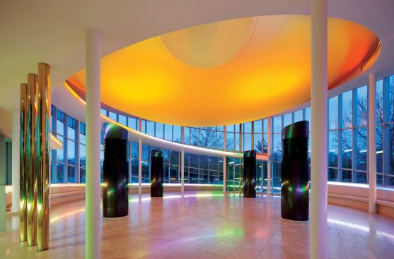 One of the largest new program elements is a new reception venue, which features an orange, inverted-dome ceiling plane and bronze-clad air trees that provide ventilation to allow a 600-person occupancy.