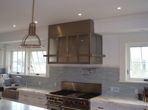 Brushed stainless steel hood with frosted-glass inserts. Project: Country House, Nantucket, Mass.; Designer/Fabricator: Brooks Custom, Mt. Kisco, N.Y.